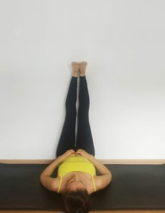 Image of a woman in legs up the wall pose